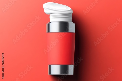 A tube of white cream with a red label and silver accents on a red background