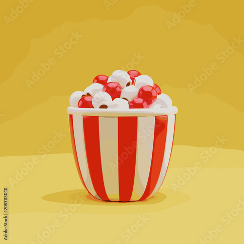 Striped bucket of popcorn mixed with red berries