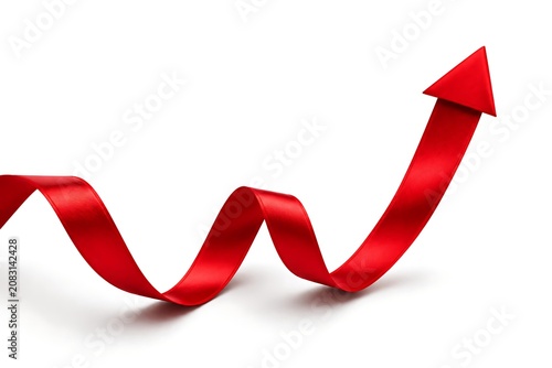 Red ribbon shaped like an upward pointing arrow on a white background representing growth shape satin curved ascending