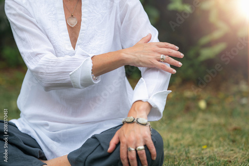 Energy healing technique with mindful body awareness and gentle self-touch to promote relaxation, balance, emotional well being and holistic wellness.