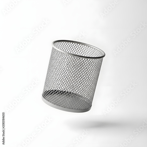 Levitating empty metal mesh trash can isolated on white