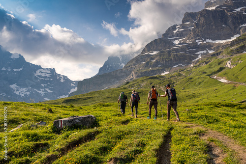 Hiking Group on Alpine Trail in Bernese Alps, Kiental Region, Switzerland