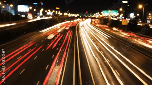 Night highway with long exposure light trails.