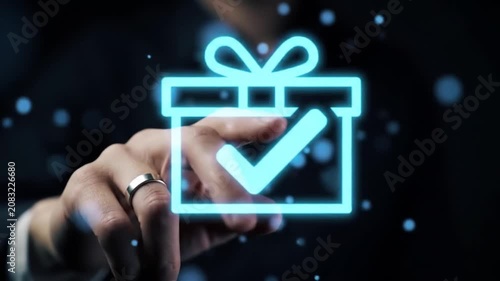 Hand touching glowing blue digital particles on dark background