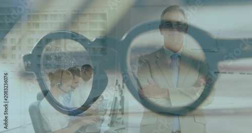 Cuadro en lienzo Manager turning as eyeglass overlay fading in, framing call-center agents and he