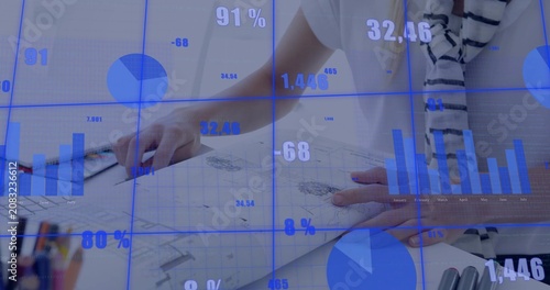 Blue overlay activating, designer sketching, reaching tablet, marking tech drawings for review