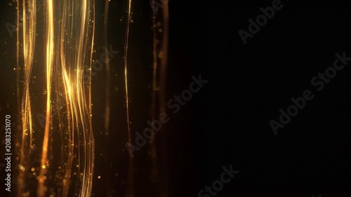 Abstract elegant golden light lines and glowing particle glitter falling on black background copy space