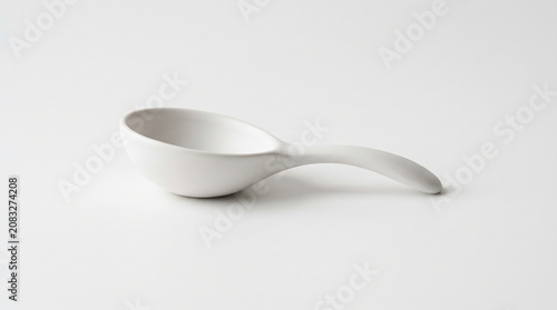 White ceramic measuring spoon