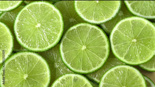 Obraz na plátně Close-up of numerous lime slices overlapping each other