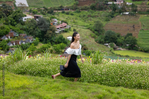 Vibrant flower garden with woman, joyful girl in flower garden, lovely woman lifestyle.