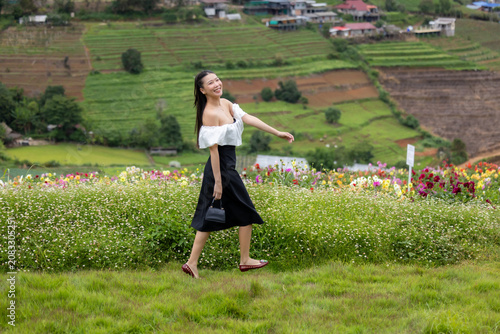 Vibrant flower garden with woman, joyful girl in flower garden, lovely woman lifestyle.