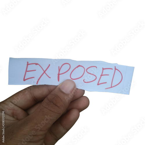 Fotografía Hand holding a paper strip with the word exposed written isolated on transparent