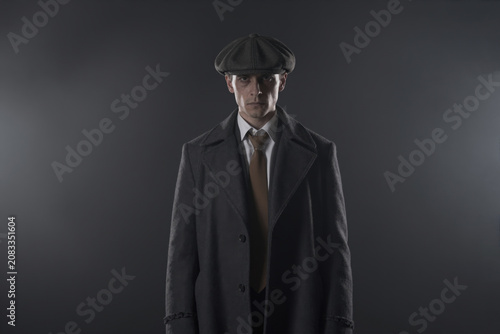 1920s Gangster in Vintage Overcoat and Flat Cap, Generative AI