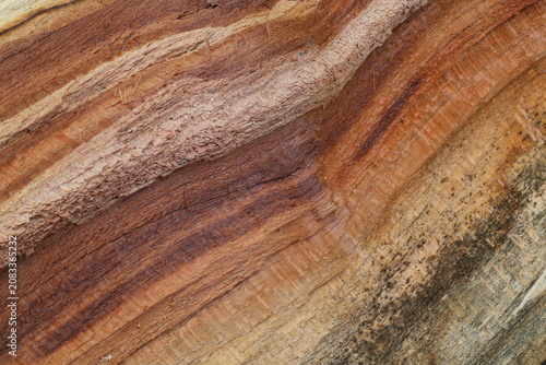 Natural weathered apricot wood texture with peeling grain background