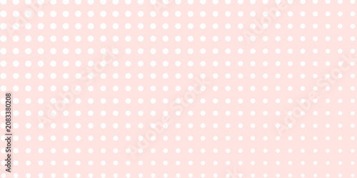 white polka dots pattern over misty rose useful as a background