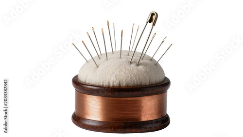 Konstfotografi Wooden pincushion with copper thread and sewing needles