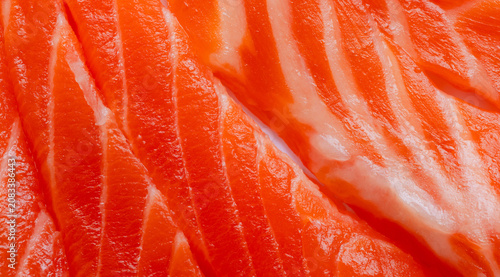 Fresh Raw Salmon Fillet Close-up Texture,Macro,A detailed close-up shot of fresh raw salmon fillet, showcasing the vibrant orange color and natural fat marbling texture of the high-quality fish meat.