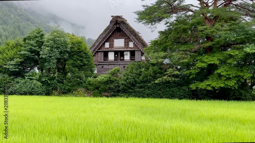 Historic Wada House in Shirakawa-go Village on a Rainy Day with Misty Mountains, Japan