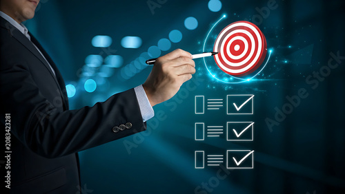 Professional Business Person Pointing at Digital Target and Checklist in a Dark Suit
