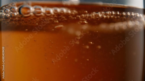 Ultra realistic cinematic footage of abstract beverage motion and bubbles, macro, no people, 4K UHD