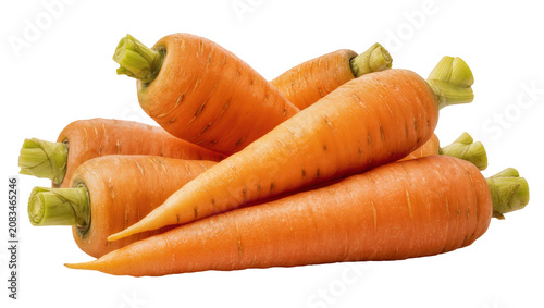 Foto Heap of fresh raw orange carrots with green tops