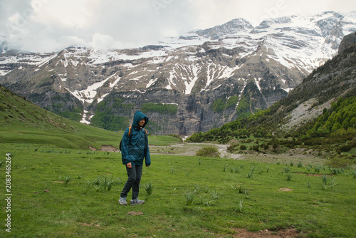 A young girl hiking alone in the Pyrenees, Pineta Valley, Monte Perdido, Camino de los Llanos de la Larri, Aragón, Huesca, Spain