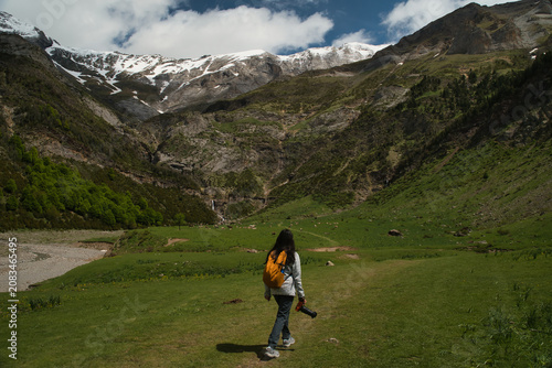 A young girl hiking alone in the Pyrenees, Pineta Valley, Monte Perdido, Camino de los Llanos de la Larri, Aragón, Huesca, Spain