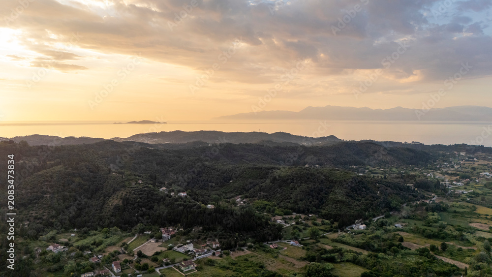 Fototapeta premium Golden hour light illuminating rural Corfu landscape
