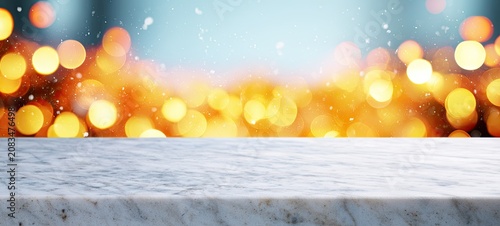 Empty marble countertop in front of blurred festive lights and falling snow