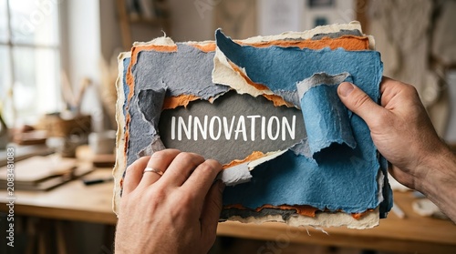 Innovative Concept with Torn Paper and Workspace Background