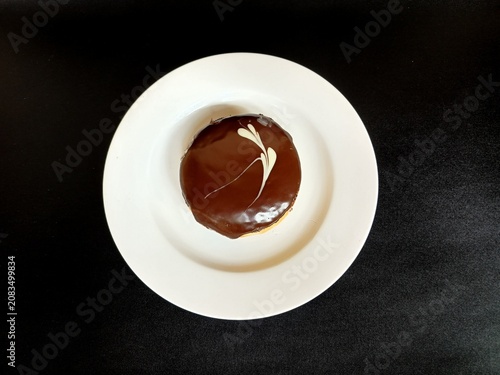 Quadro su tela Donut with black background