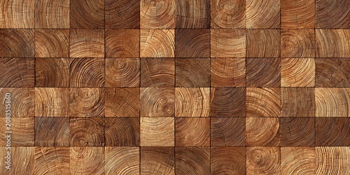 Seamless texture of square wooden blocks with visible end grain growth rings arranged in a mosaic grid pattern for interior design background