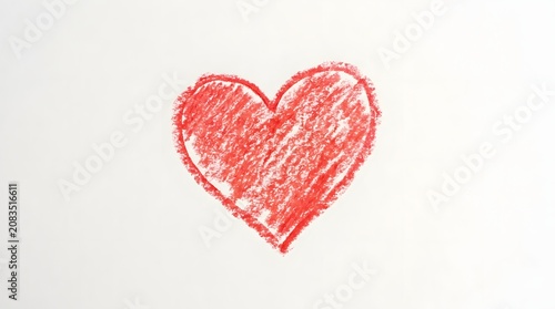 A hand drawn red heart shape with a textured crayon or pencil sketch style for romantic cards and artistic valentine day design projects