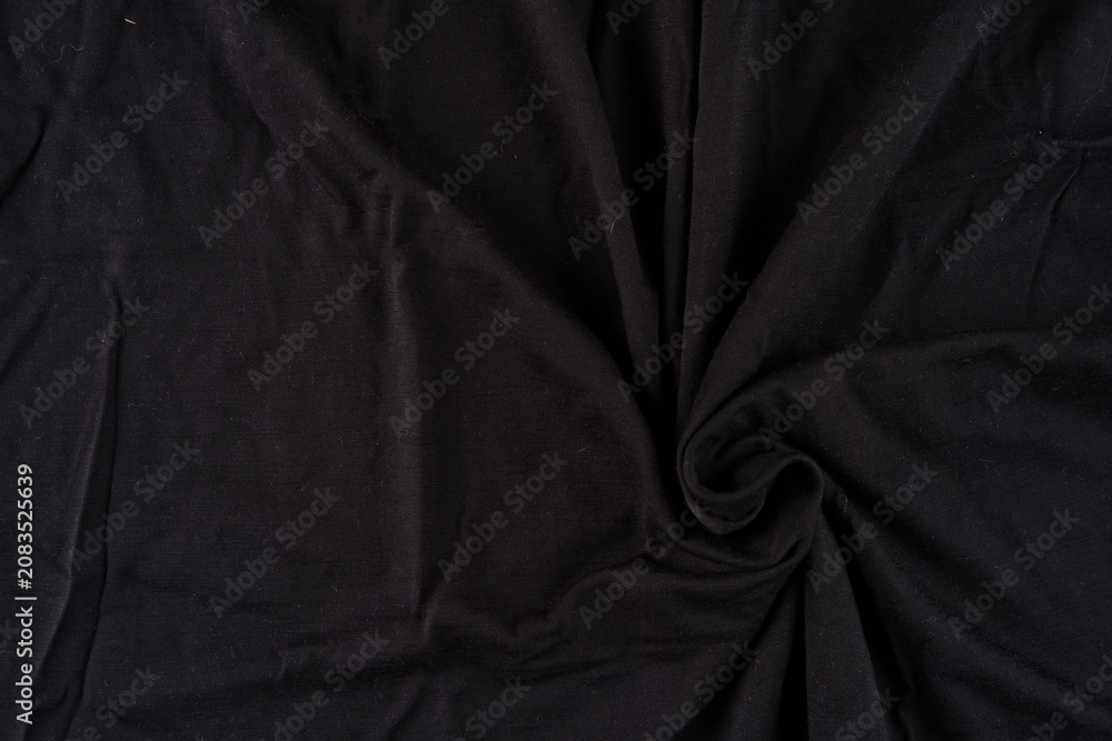 Obraz premium Black Fabric Swirl Background With Texture and Wrinkles for Textile or Product Photography