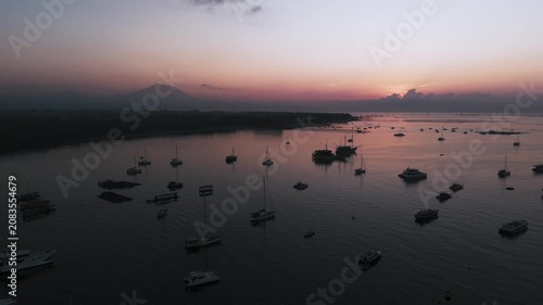 Bali Coastline at Sunrise with Numerous Boats and Calm Ocean - Drone View