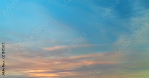 Time lapse of beautiful clouds with soft pastel colors at sunset