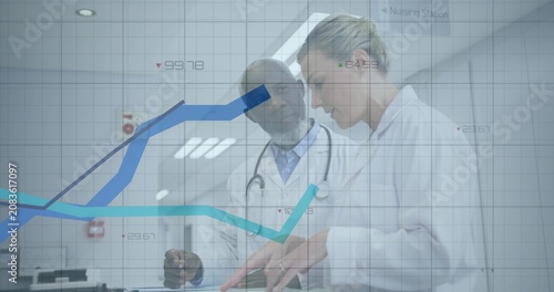 Foto Drs checking records for care flipping file pointing causing data graphs rising