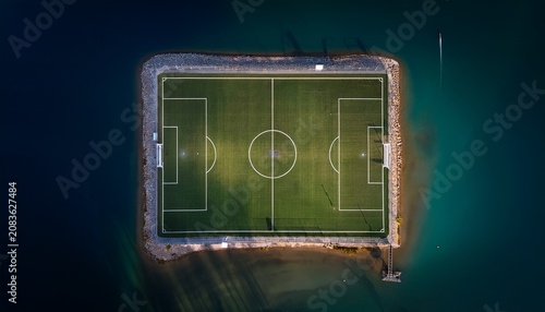 an aerial view of an empty soccer field with intricate markings