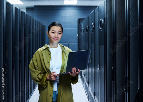Female IT Professional in Data Center