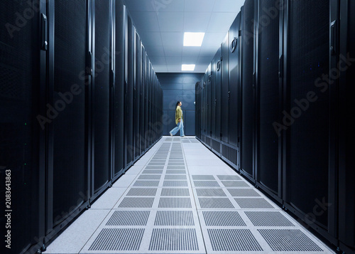 Female Cybersecurity Professional Working in Data Center