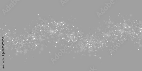 Christmas shimmer with bright particles. Bright white glitter texture, soft light beams and luminous dust effect. Vector PNG illustration.