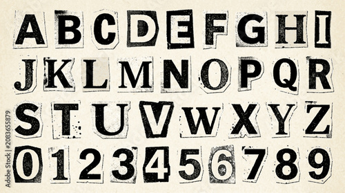 Ransom note style alphabet and number set cut out from newspaper magazine paper