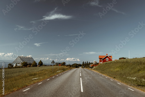 Photography Beautiful scenic view of Sweden landscape with traditional red houses