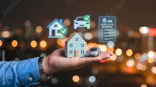 A hand holding a house and car model, representing home and auto insurance bundle. The background shows a bokeh city light, symbolizing a city life insurance.