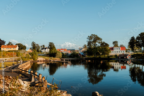 Photography Beautiful scenic view of Sweden landscape with traditional red houses