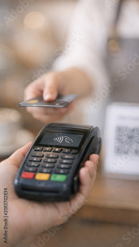 A handheld electronic payment processing device for credit cards and mobile payments.
