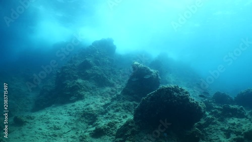 choppy water wavy sea underwater wave hit on rocks and makes foam on the surface of the sea ocean scenery backgrounds