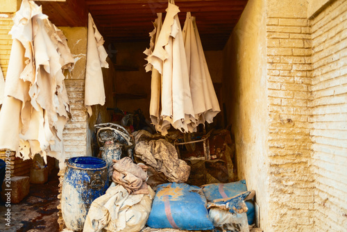 Fotografie Traditional Moroccan tannery with hanging textiles