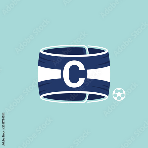 A blue and white captain armband next to a small soccer ball