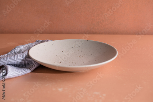 Beautiful table setting. Empty plates and cutlery on table.